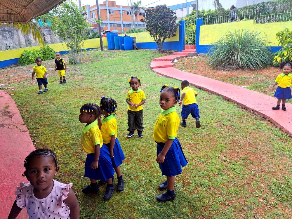 Young pupils playing in the school garden