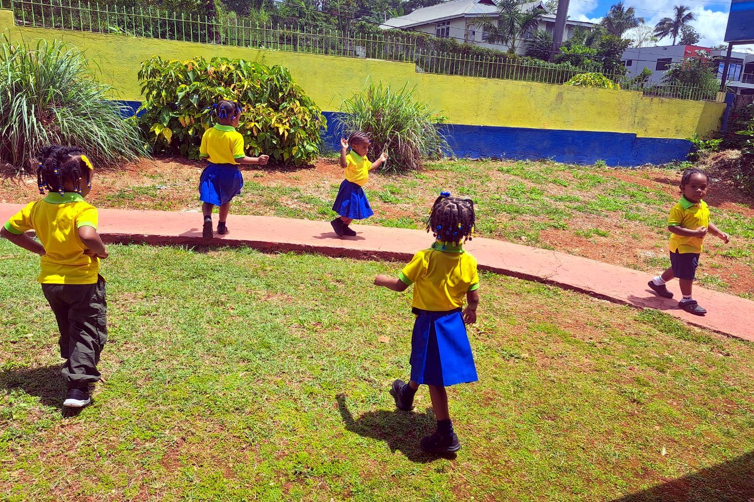 Martin's Prep pupils playing in the sunny school garden