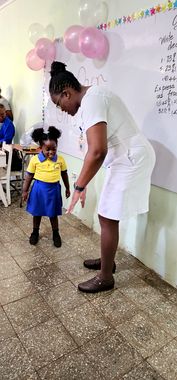 A teacher and pupil at a class celebration